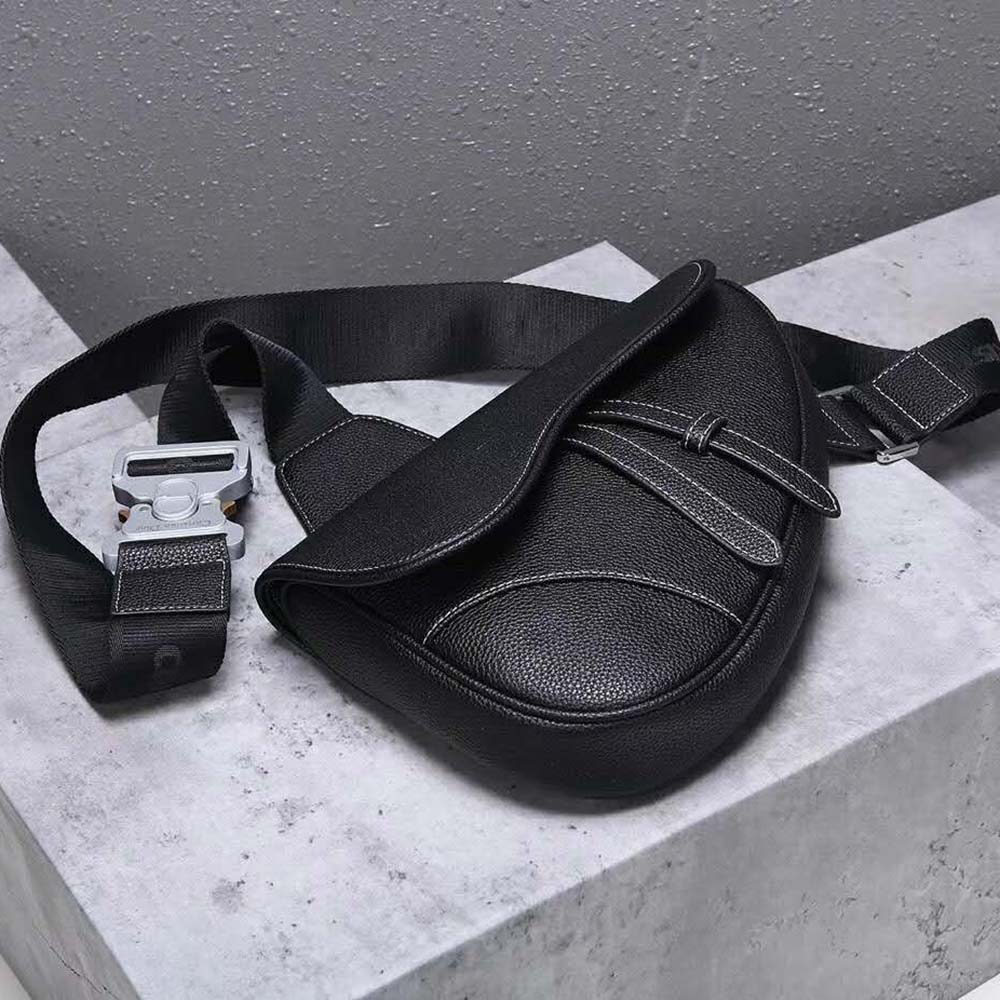 Side angle showing smooth black calfskin and adjustable strap