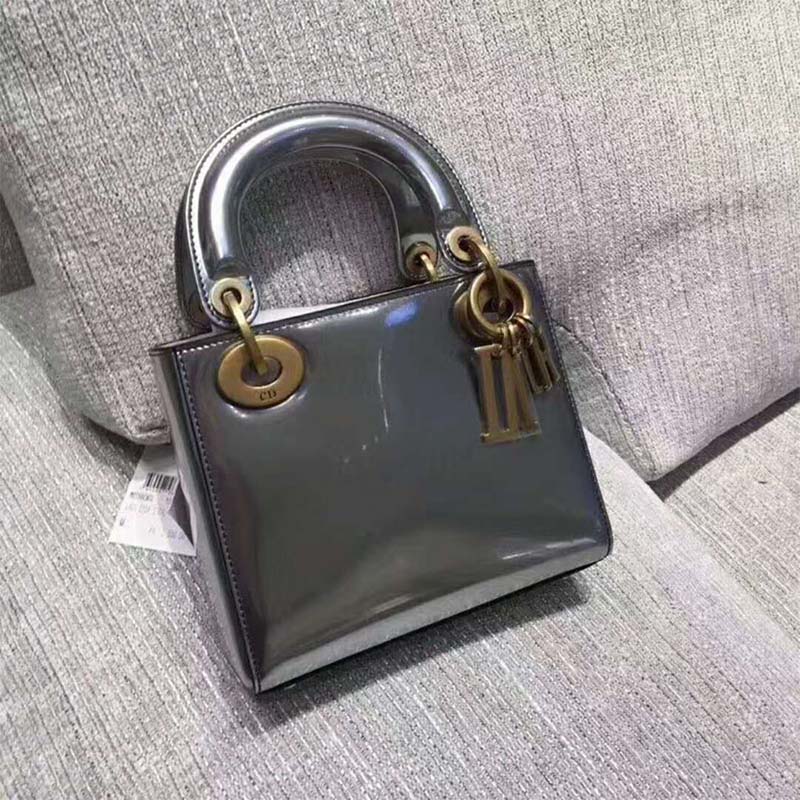 Side angle showing compact silhouette of Dior Mini Lady Dior Bag