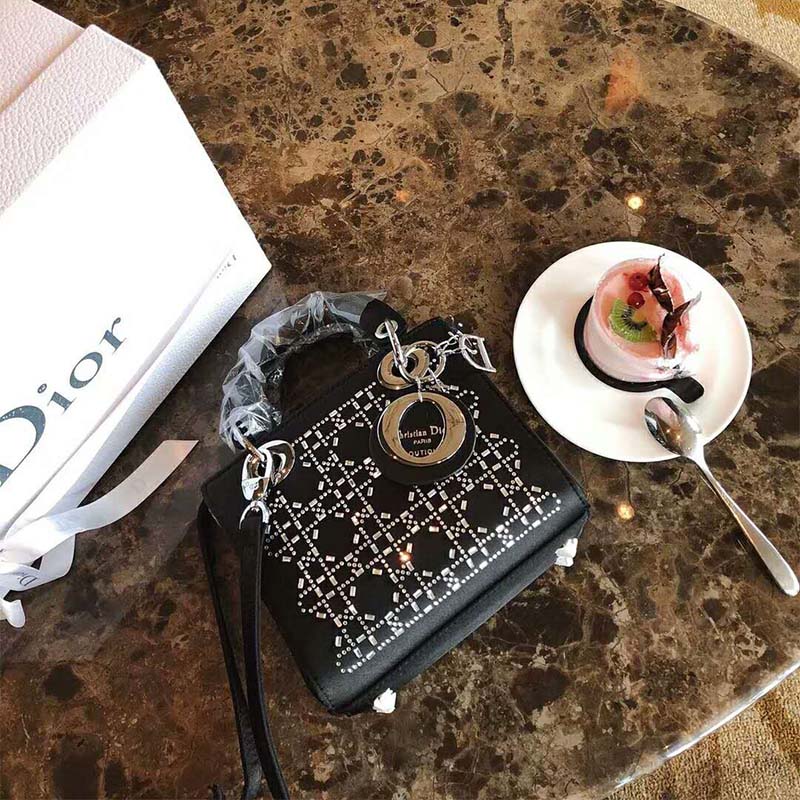 Close-up of rhinestone detailing on Dior Mini Lady Dior Bag in Black Satin