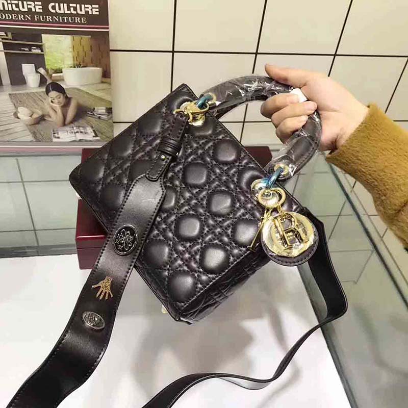 Side angle showing gold hardware and adjustable strap on Dior My Lady Dior Bag