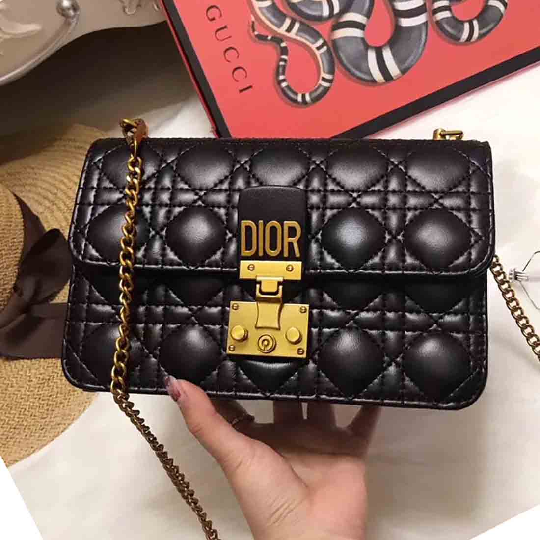 Side angle showing slim profile of Dior Small Dioraddict Flap Bag