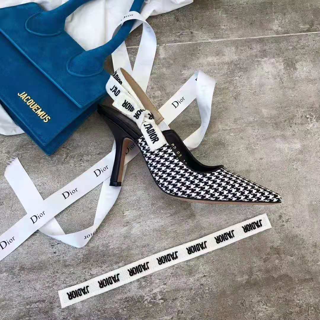 Close-up on gold ‘J’adior’ hardware on slingback strap of Dior pump