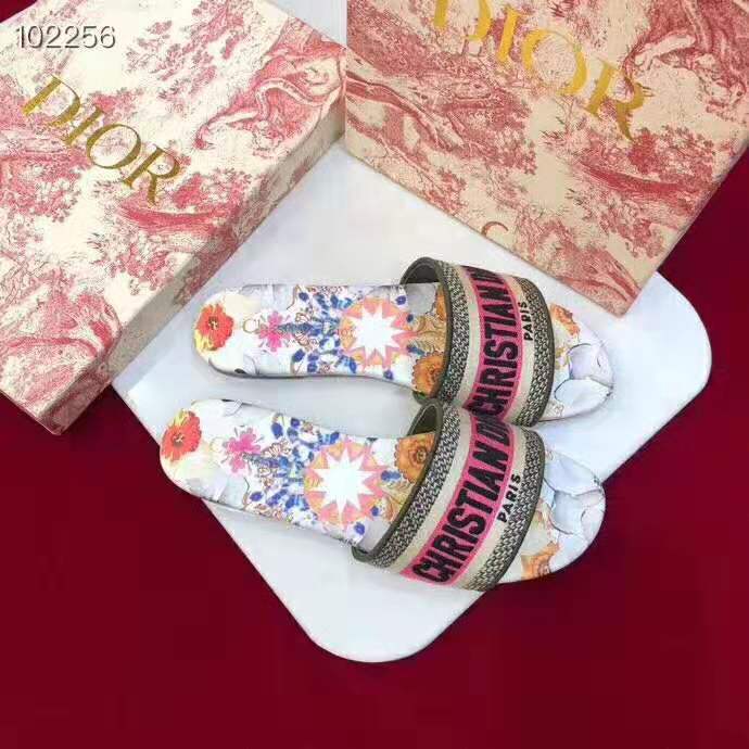 Close-up of kaleidiorscopic hardware detail on Dior slide in rose
