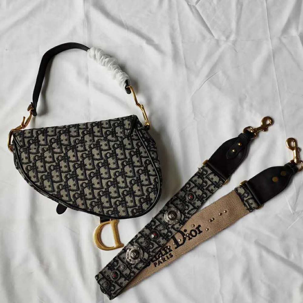 Side angle showing curved silhouette of Dior Women Dior Oblique Saddle Bag-Navy