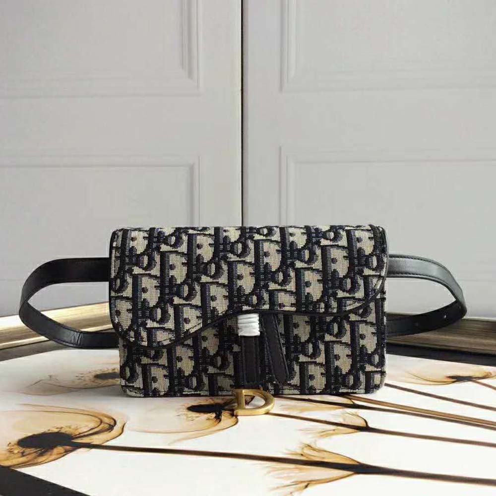 Close-up of antique gold hardware and leather trim on Dior Oblique Saddle Belt Bag-Navy