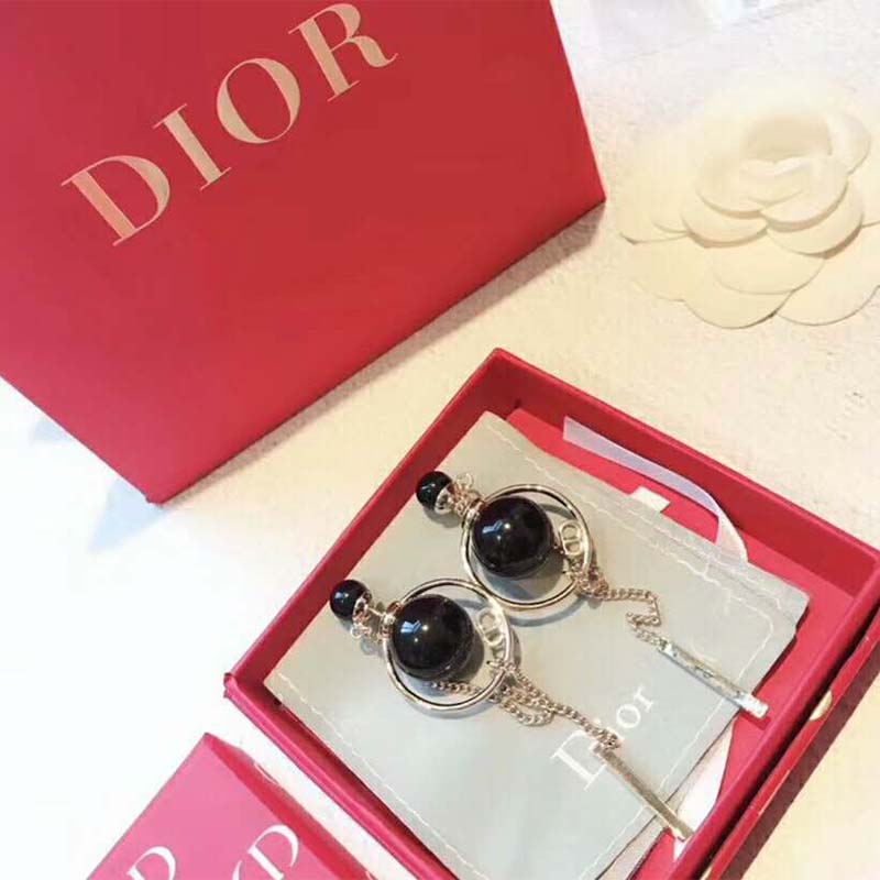 Close-up on gold-tone hardware of Dior Women Dior Tribales Earrings-Black