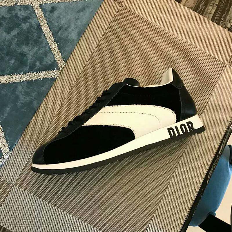 Top-down view showing laces and silver-tone Dior branding on Diorun Trainer