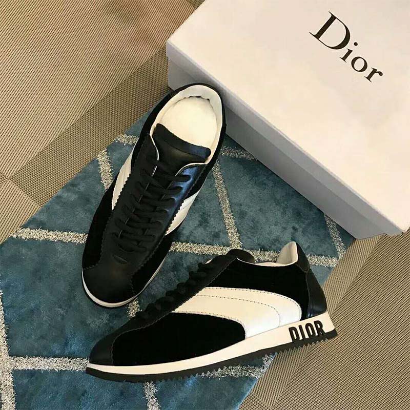 Close-up of black velvet and calfskin leather on Dior Women Diorun Trainer