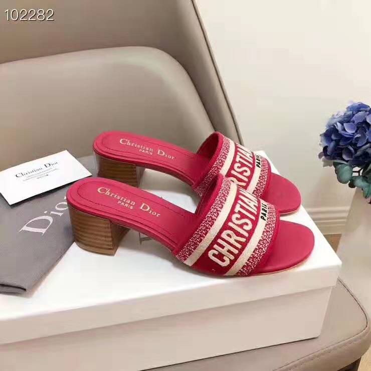Close-up of gold Dior ‘CD’ logo hardware on Dway Mule