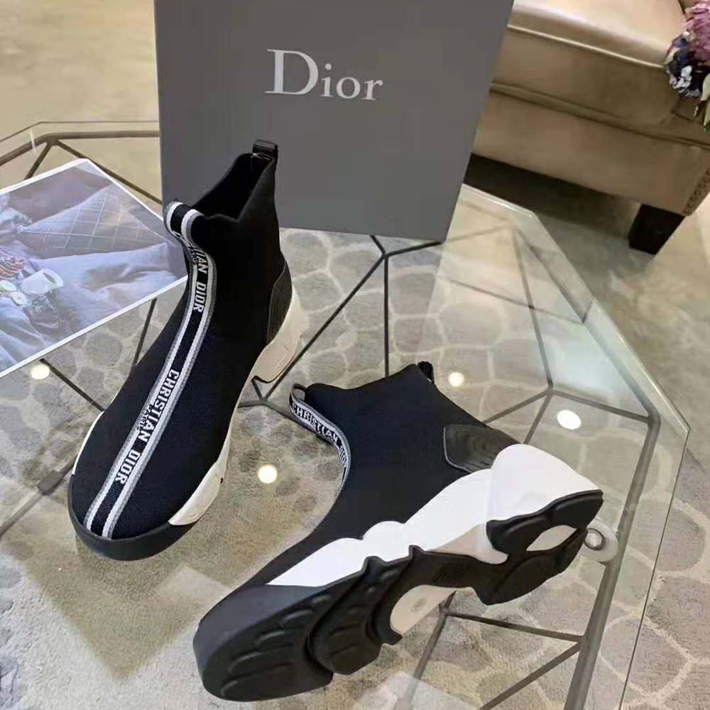 Overhead shot highlighting laces and Dior logo on black high-top sneaker