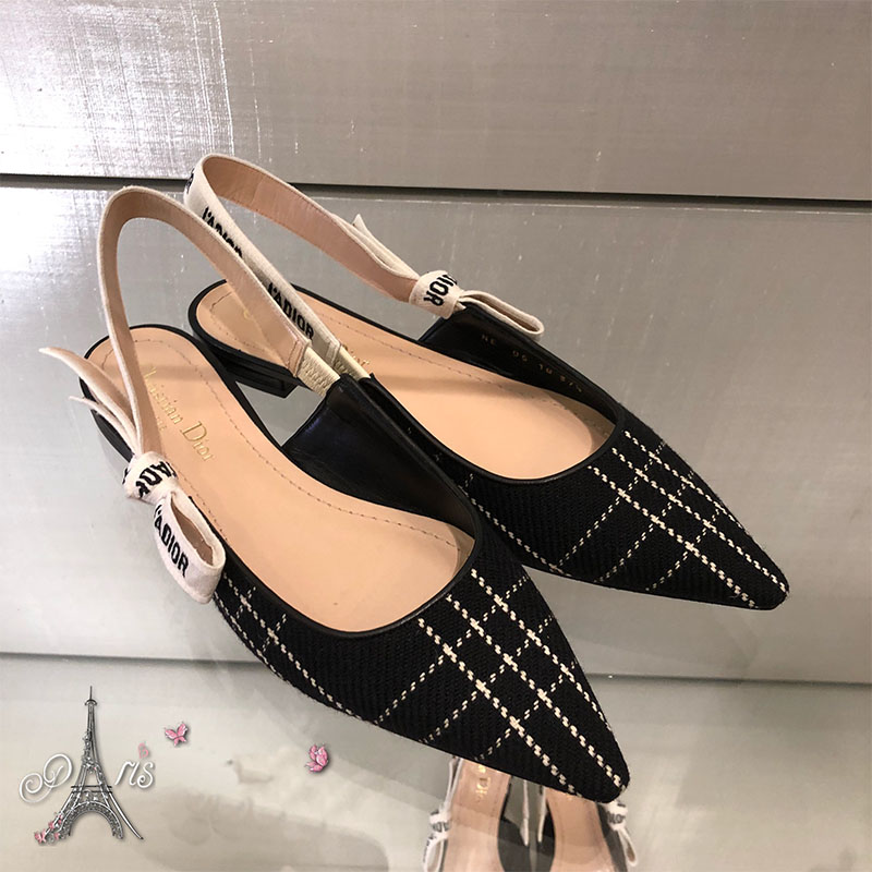 Overhead shot showing black tartan wool texture and low heel detail