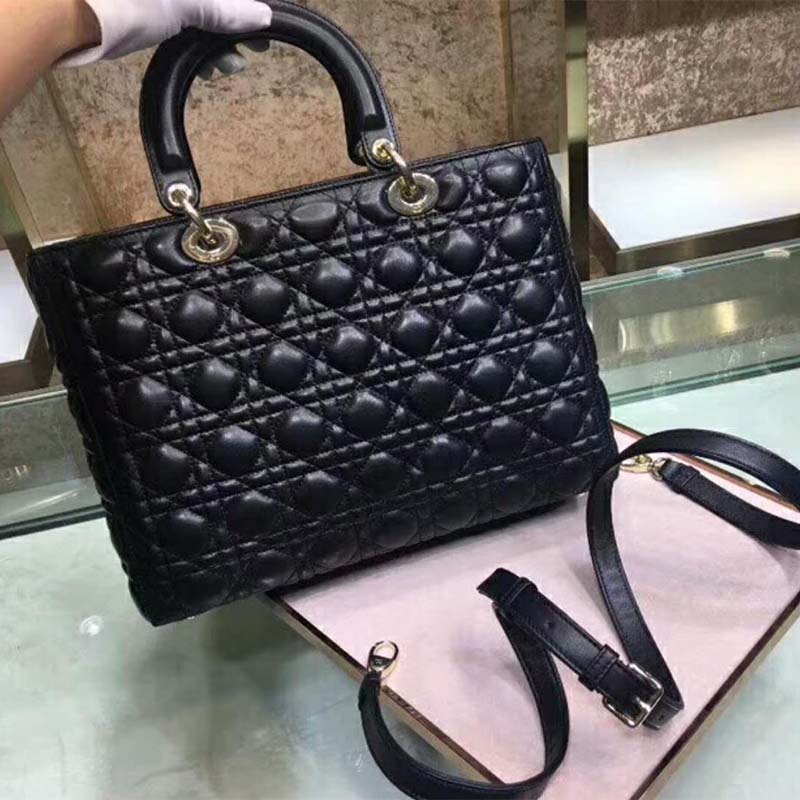 Side angle highlighting gold-tone hardware on Dior Women Lady Dior Tote