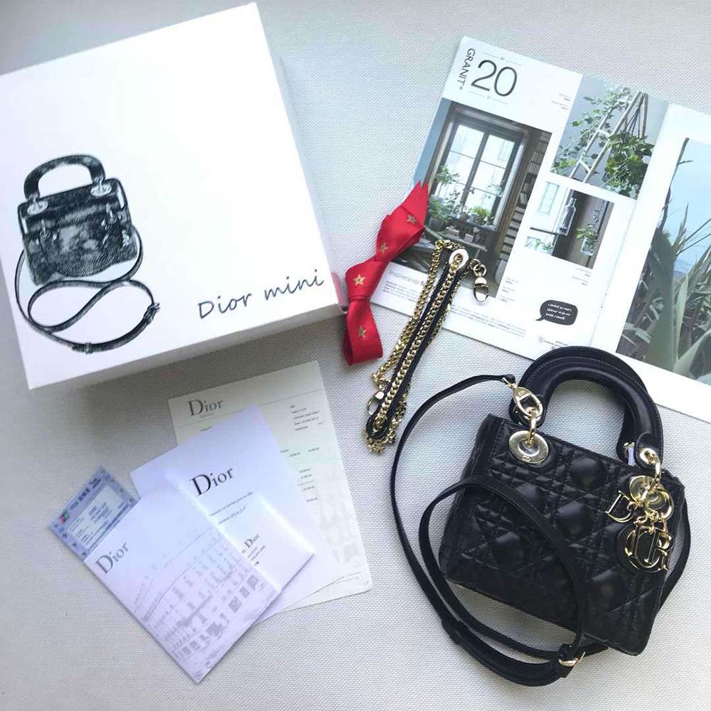 Close-up of ABCDIOR silver letter hardware on black lambskin bag