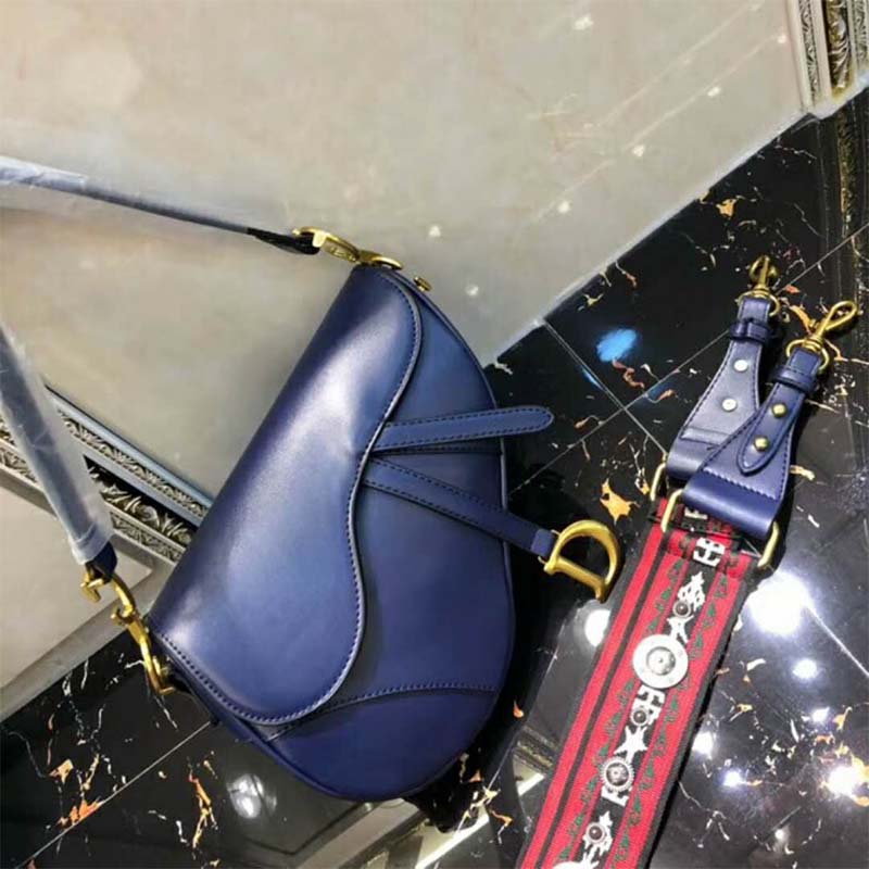 Close-up of gold-tone hardware on Dior Women Mini Saddle Bag