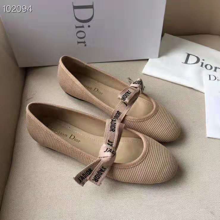 Close-up of J’adior ribbon detail on pink ballet flat by Dior