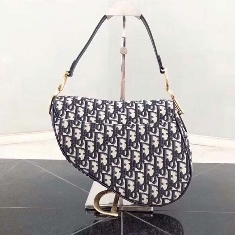 Side profile showing adjustable strap on Dior Women Saddle Bag