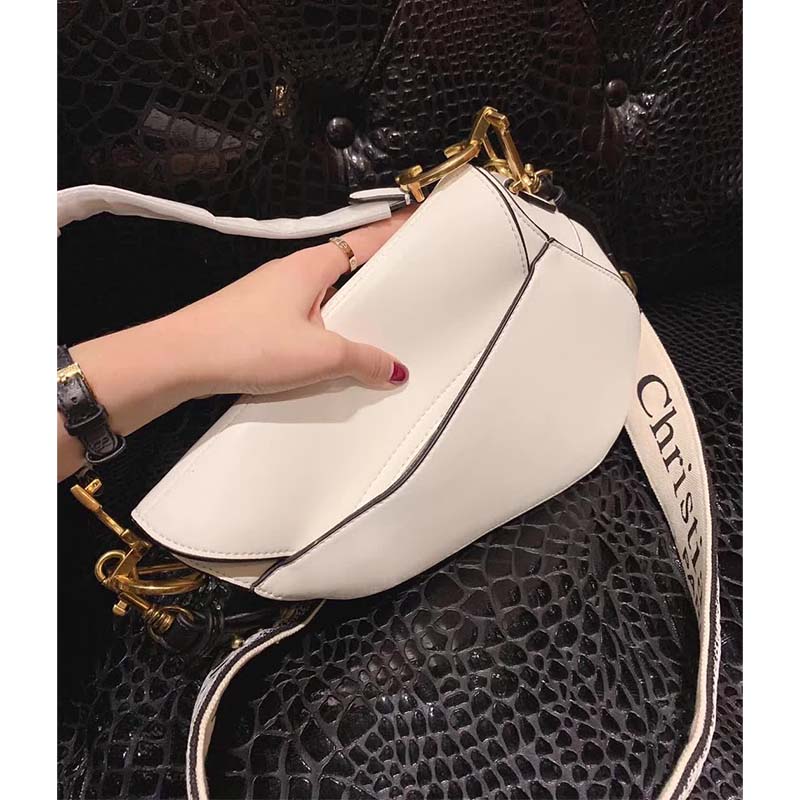 Side angle of Dior Women Saddle Calfskin Bag-White highlighting smooth white leather