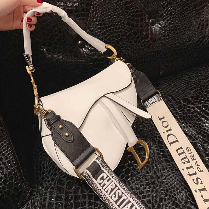 Close-up of silver-tone ‘D’ hardware on Dior Women Saddle Calfskin Bag-White