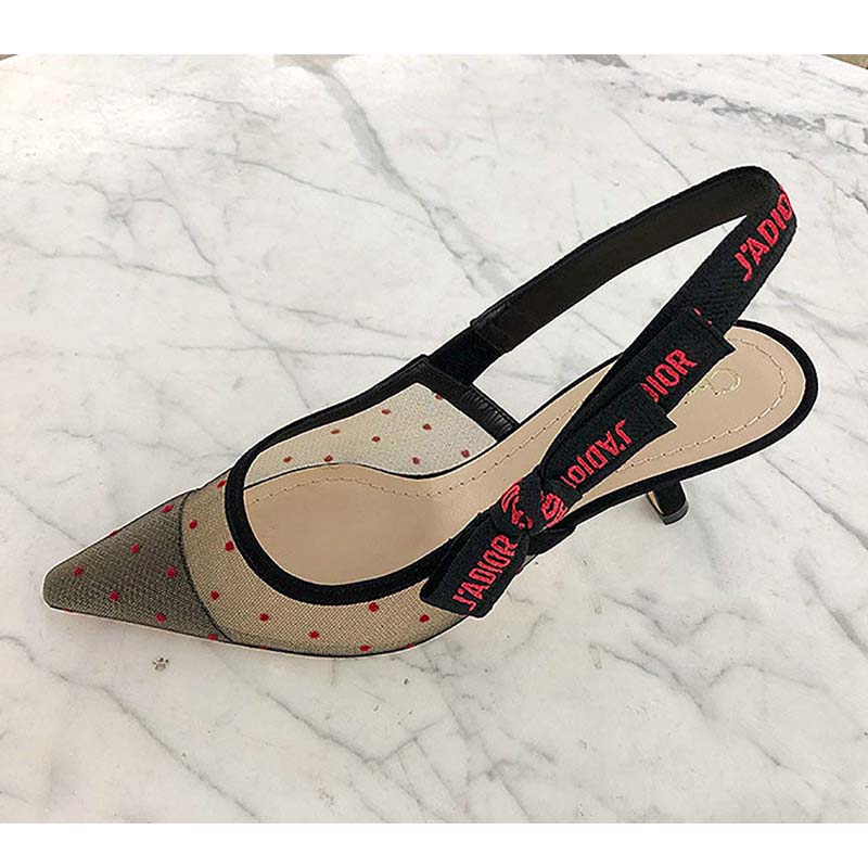 Detail of gold J’Adior buckle on red slingback heel shoes