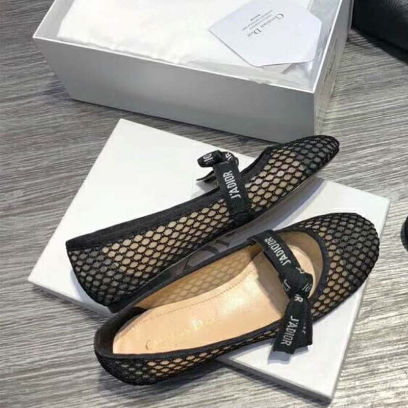 Close-up of J’Adior ribbon detail on black mesh ballet pump