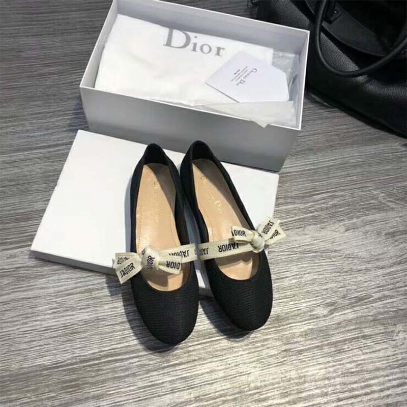 Close-up on J’Adior ribbon and silver hardware detail on ballet pump