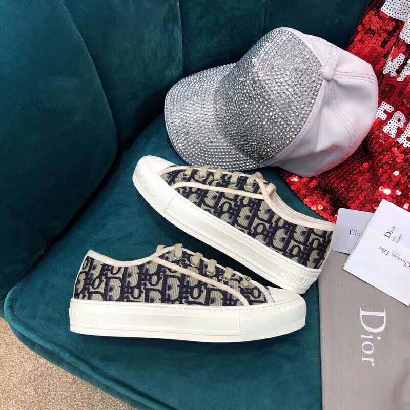 Close-up of black embroidered canvas and Dior logo on Walk’n’Dior sneaker