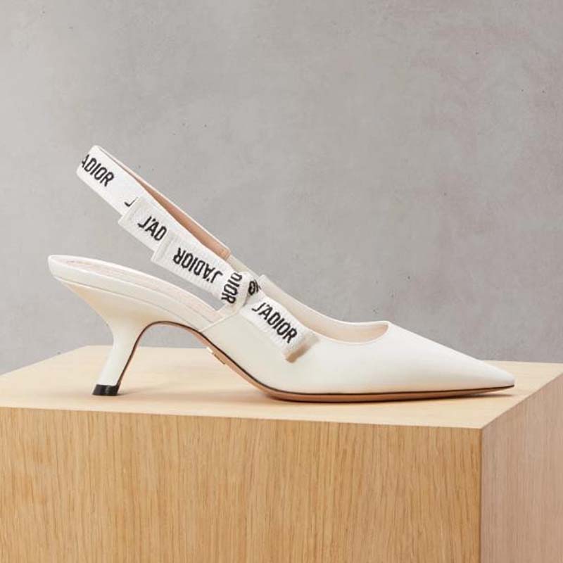 Close-up of J’Adior ribbon detail on white patent leather sling-back shoes