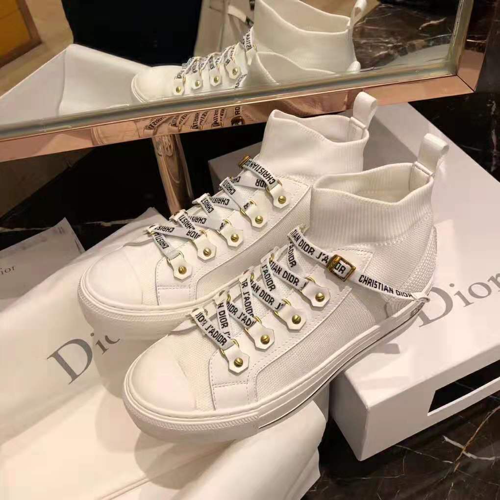 Close-up detail of Dior signature branding on sneaker side panel