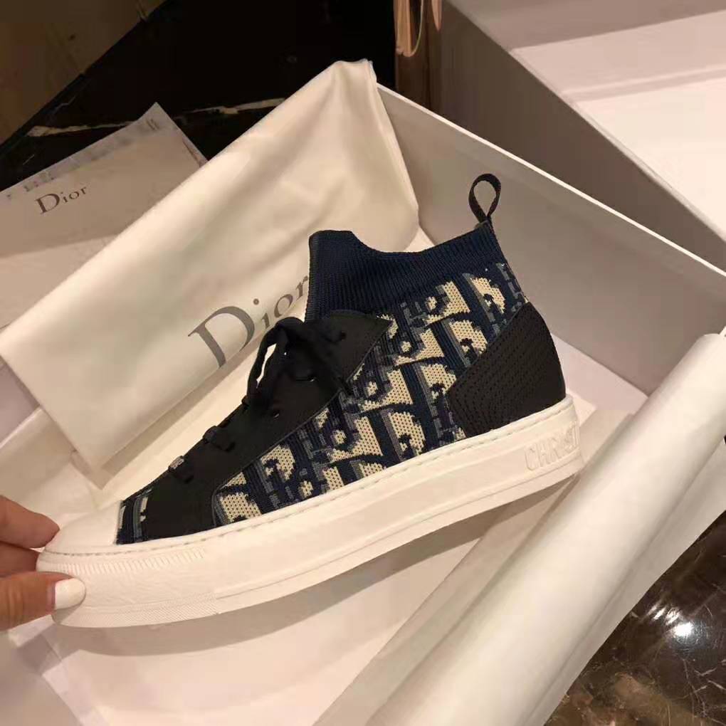 Close-up of navy technical knit fabric and Dior Oblique pattern on sneaker