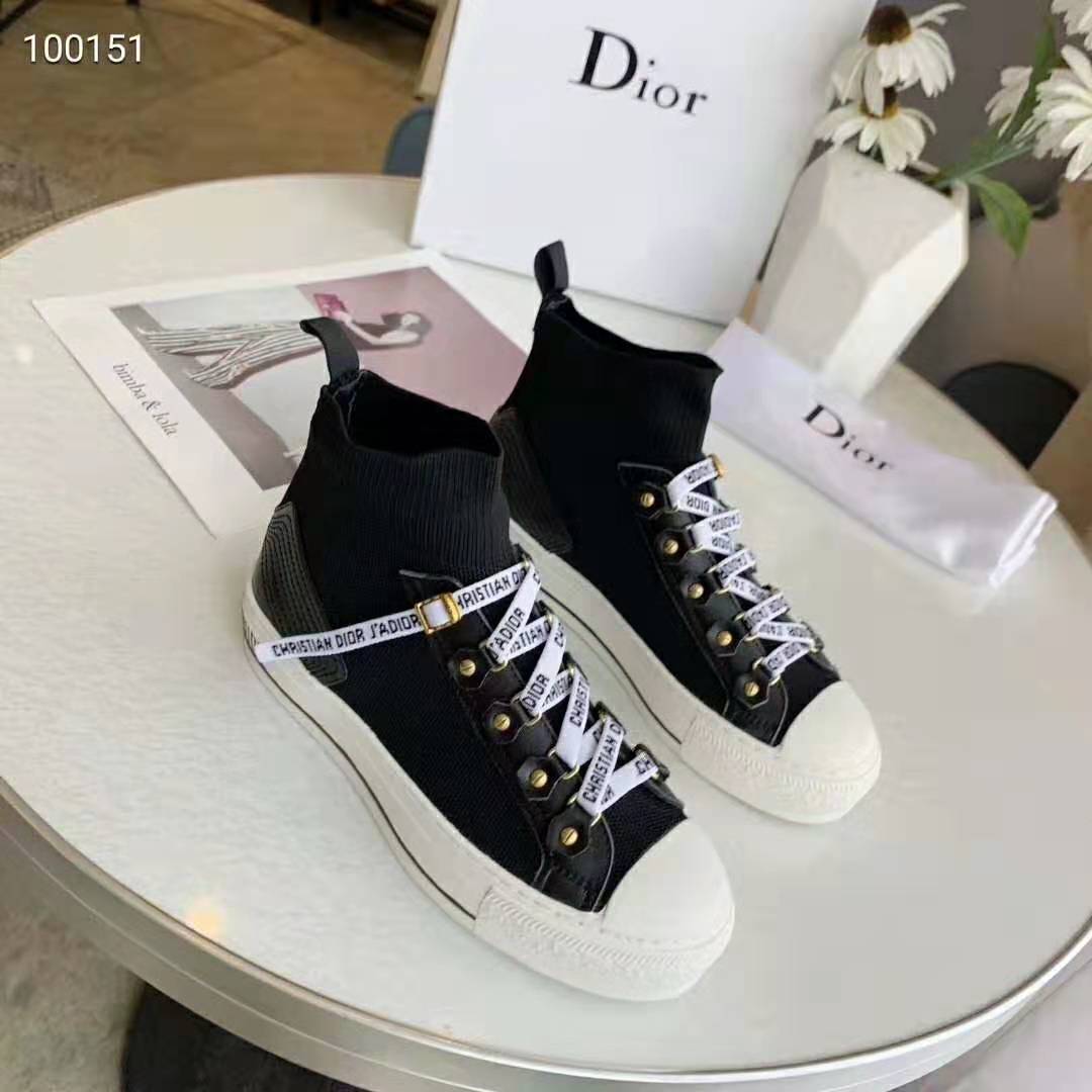 Close-up of black technical knit and Dior embossed detail on sneaker