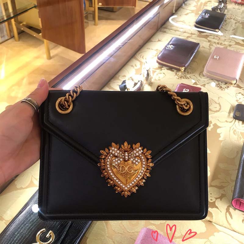 Close-up of gold-tone hardware on Dolce Gabbana D&G Medium Devotion Bag