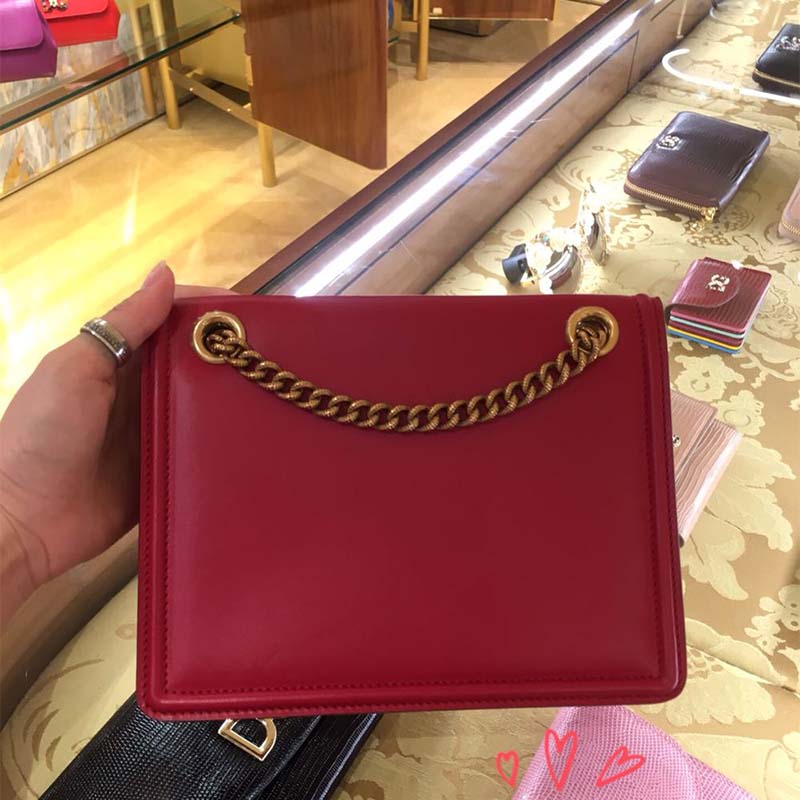 Side angle showing adjustable shoulder strap of Dolce Gabbana Devotion Bag
