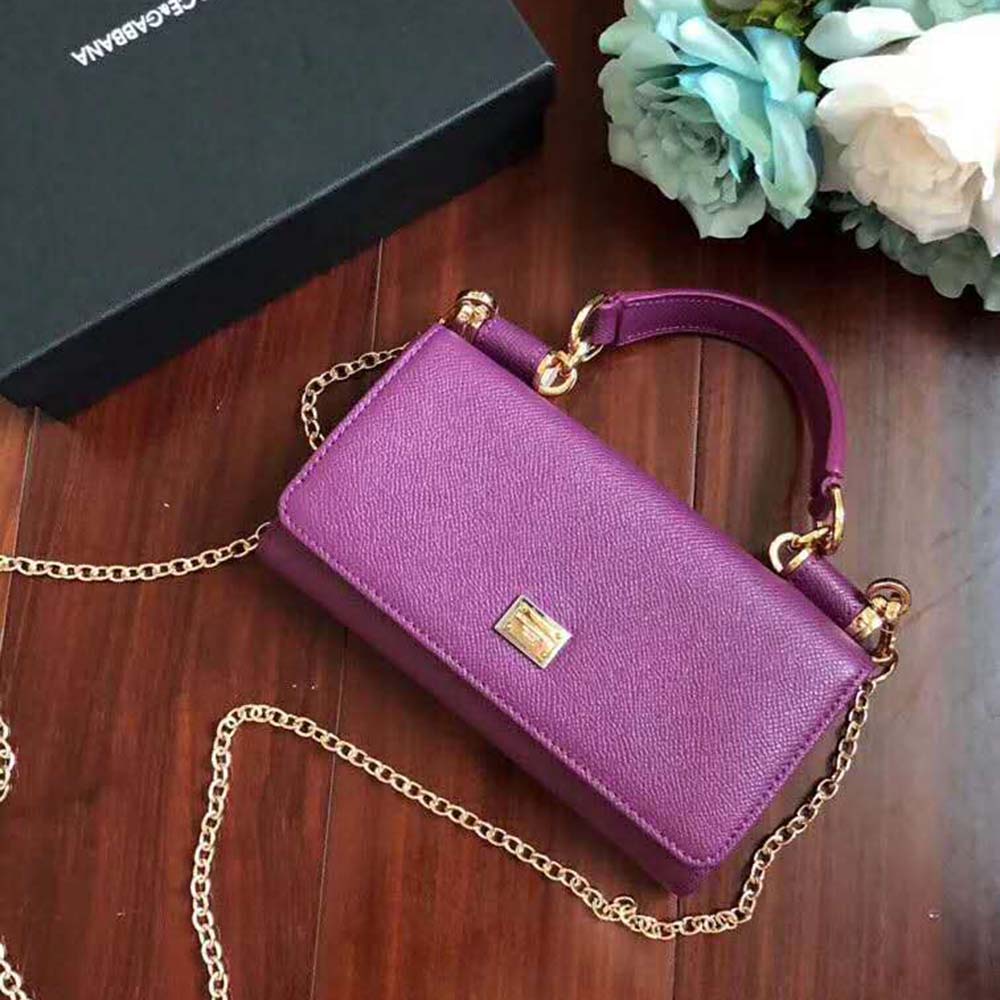 Close-up of gold D&G logo hardware on purple Min Von Bag
