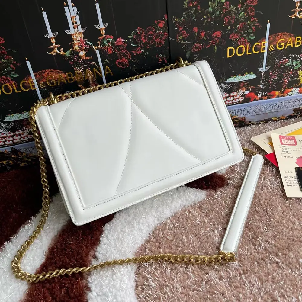 Side angle showing strap and flap closure of Dolce Gabbana D&G Medium Devotion Bag