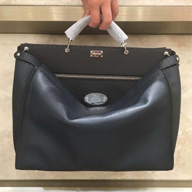 Close-up of gold-tone hardware and Selleria stitching on Fendi Peekaboo bag