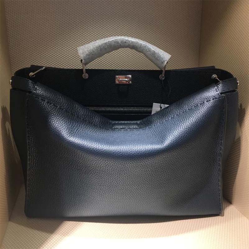 Side profile showing structured silhouette of Fendi Unisex Peekaboo Selleria Handle Bag