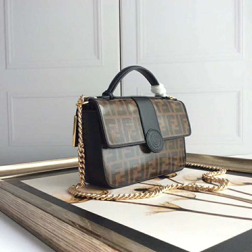 Side angle showing flap closure and strap on Fendi small shoulder bag
