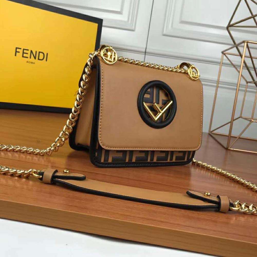 Side angle showing compact silhouette of Fendi Women KAN I F Small Black Leather Mini-Bag