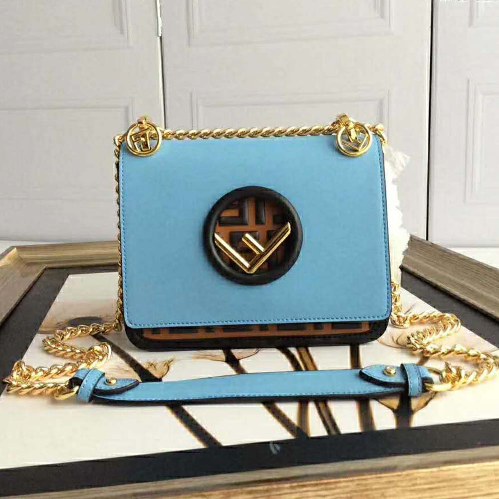 Side angle showing smooth leather and silver hardware on Fendi Women Kan I F Small Pale Blue Leather Mini Bag