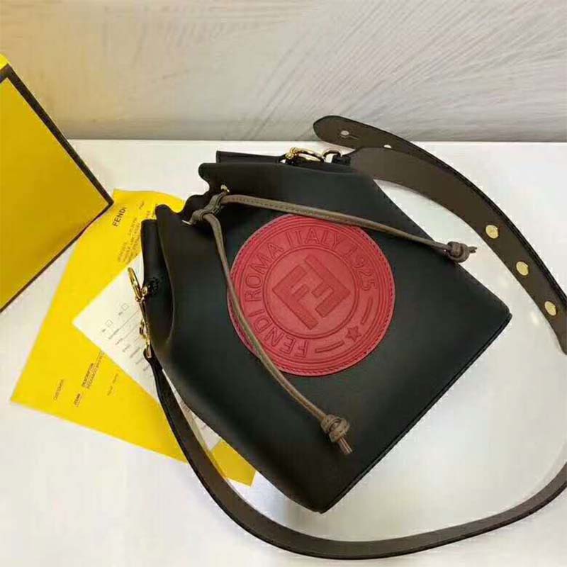 Close-up of gold-tone push-lock closure on Fendi Women Mon Tresor Black Leather Bag