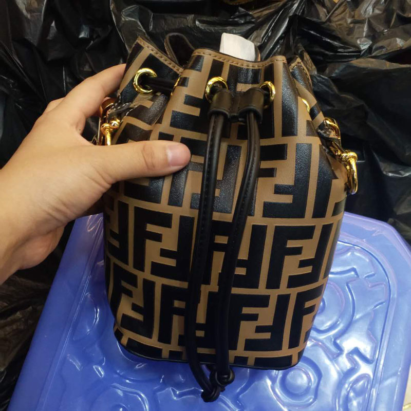 Close-up of gold-tone hardware on Fendi Women Mon Tresor Mini Bag