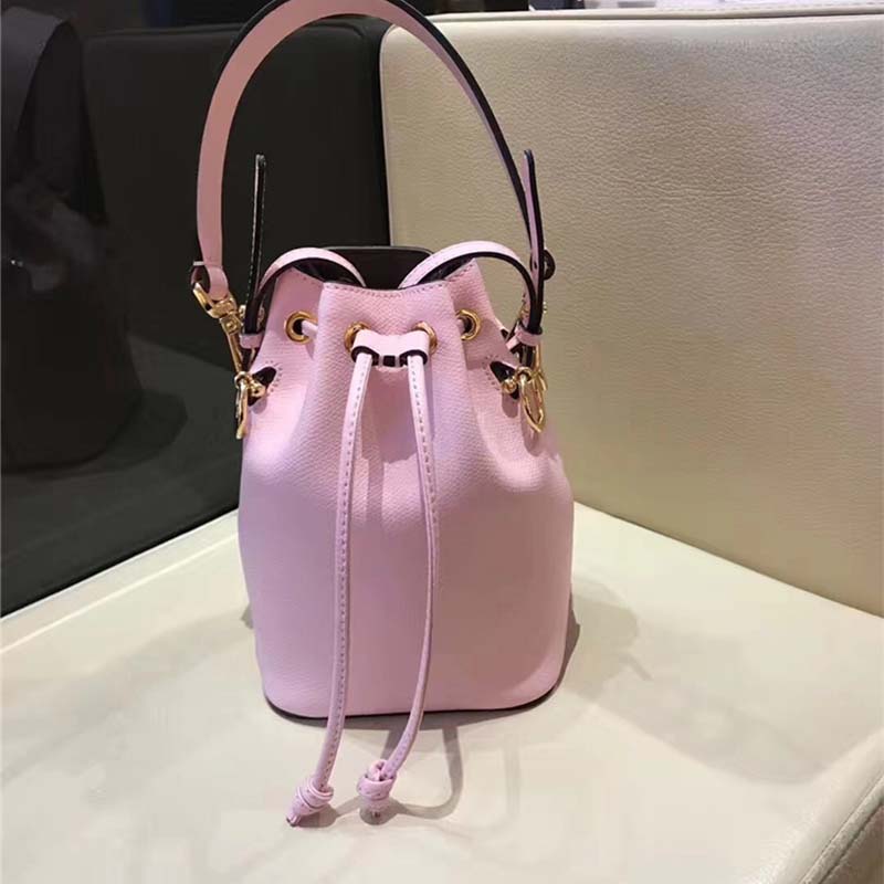 Close-up of gold hardware and pink leather texture on Fendi mini-bag
