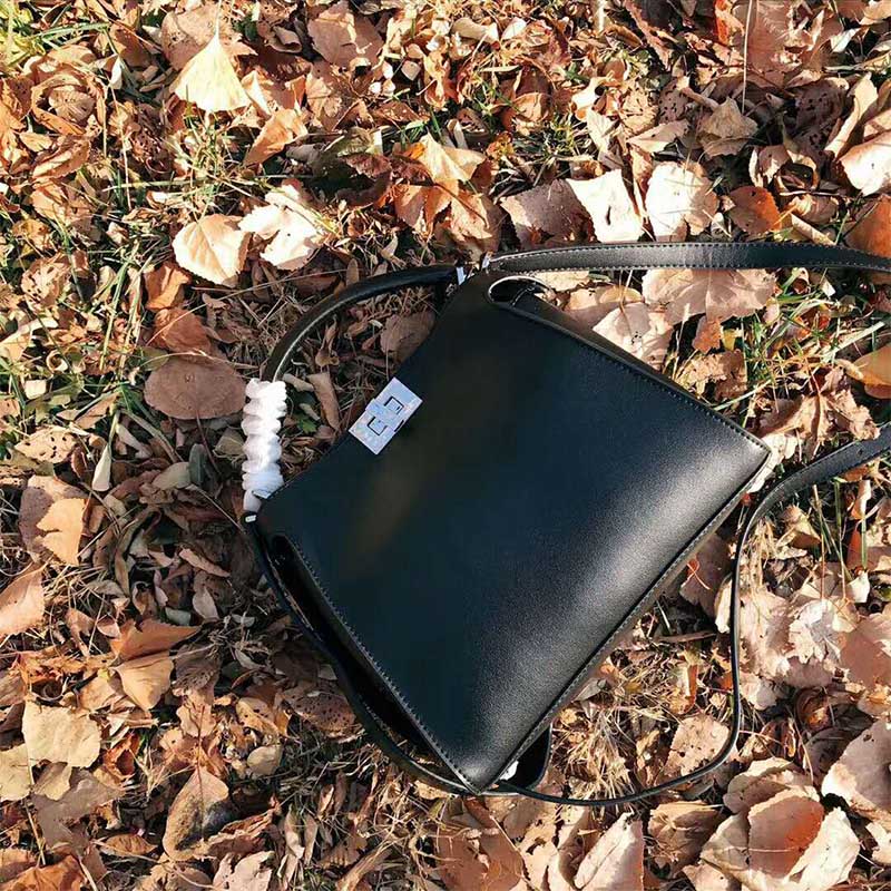 Close-up of matte gold-tone closure on Fendi Women Peekaboo Essential Black Leather Bag