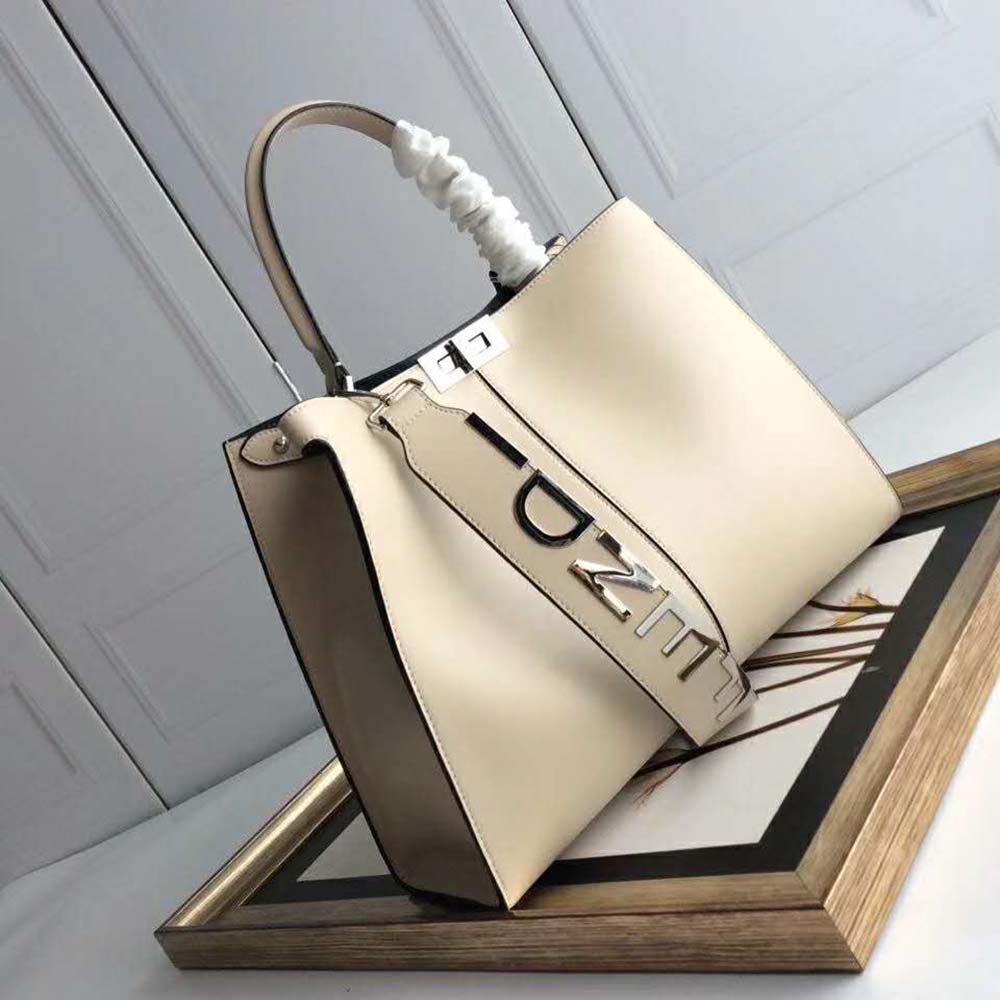 Side angle showing dual compartments of Fendi Women Peekaboo X-Lite Regular-White