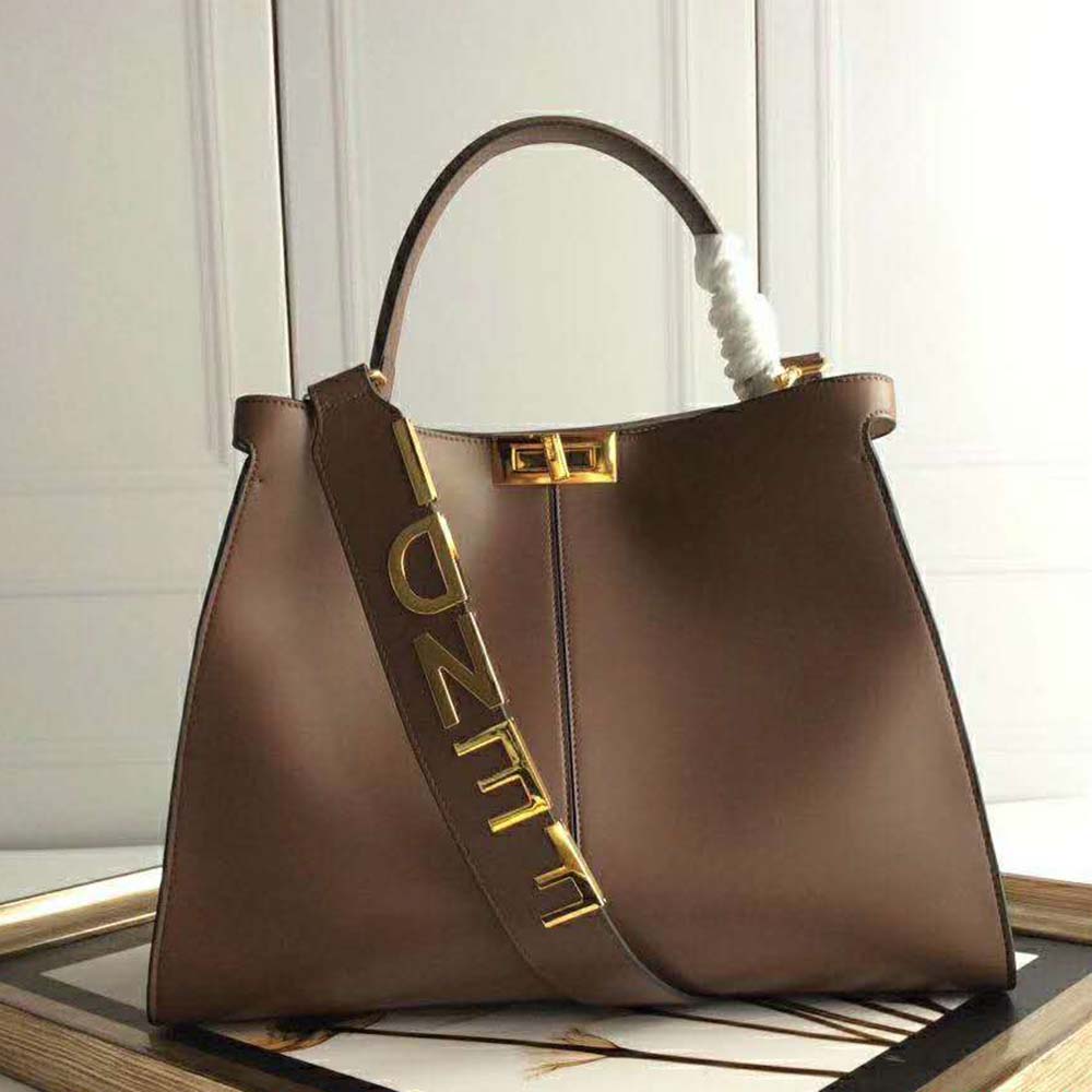 Close-up of gold hardware detail on Fendi Women Peekaboo X-Lite Regular-Brown