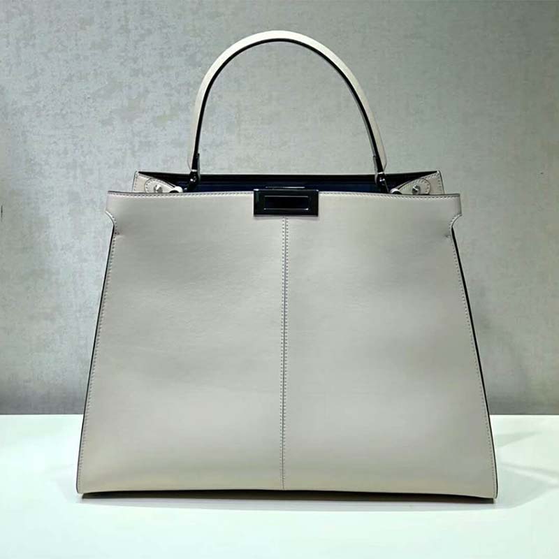 Close-up of gold-tone hardware on Fendi Women Peekaboo X-Lite bag