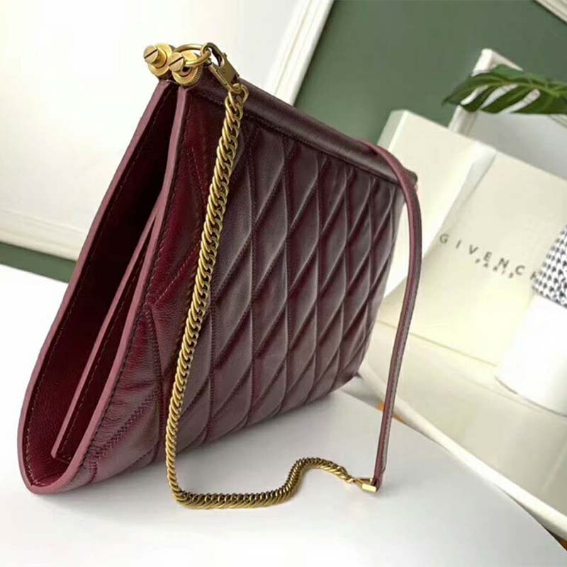 Side angle showing silhouette and flap closure of Givenchy Women Medium Gem Bag