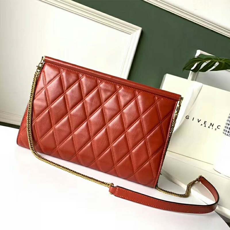 Side angle showing flap closure and strap on Givenchy Women Medium Gem Bag
