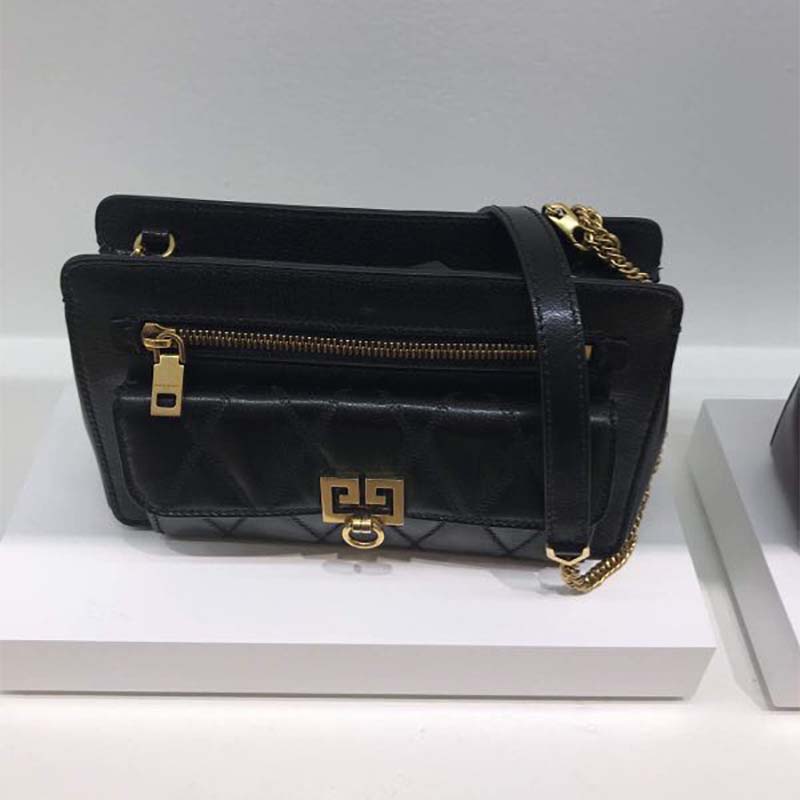 Side profile showing silhouette and adjustable strap of Givenchy pocket bag