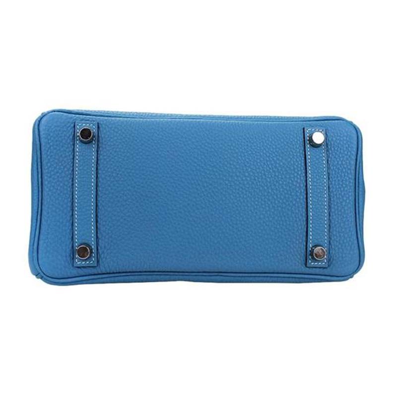 Side profile showing silhouette of Hermes Birkin 25 Bag in vibrant blue